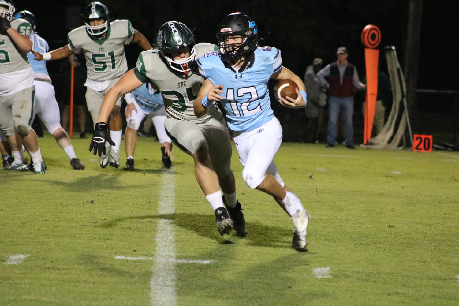 Ben Burk carries the ball against Flagler Palm Coast Oct. 3. He ran for two scores on the night.